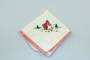 Image of Embroidered napkin with scene of Inuit woman picking flowers/berries